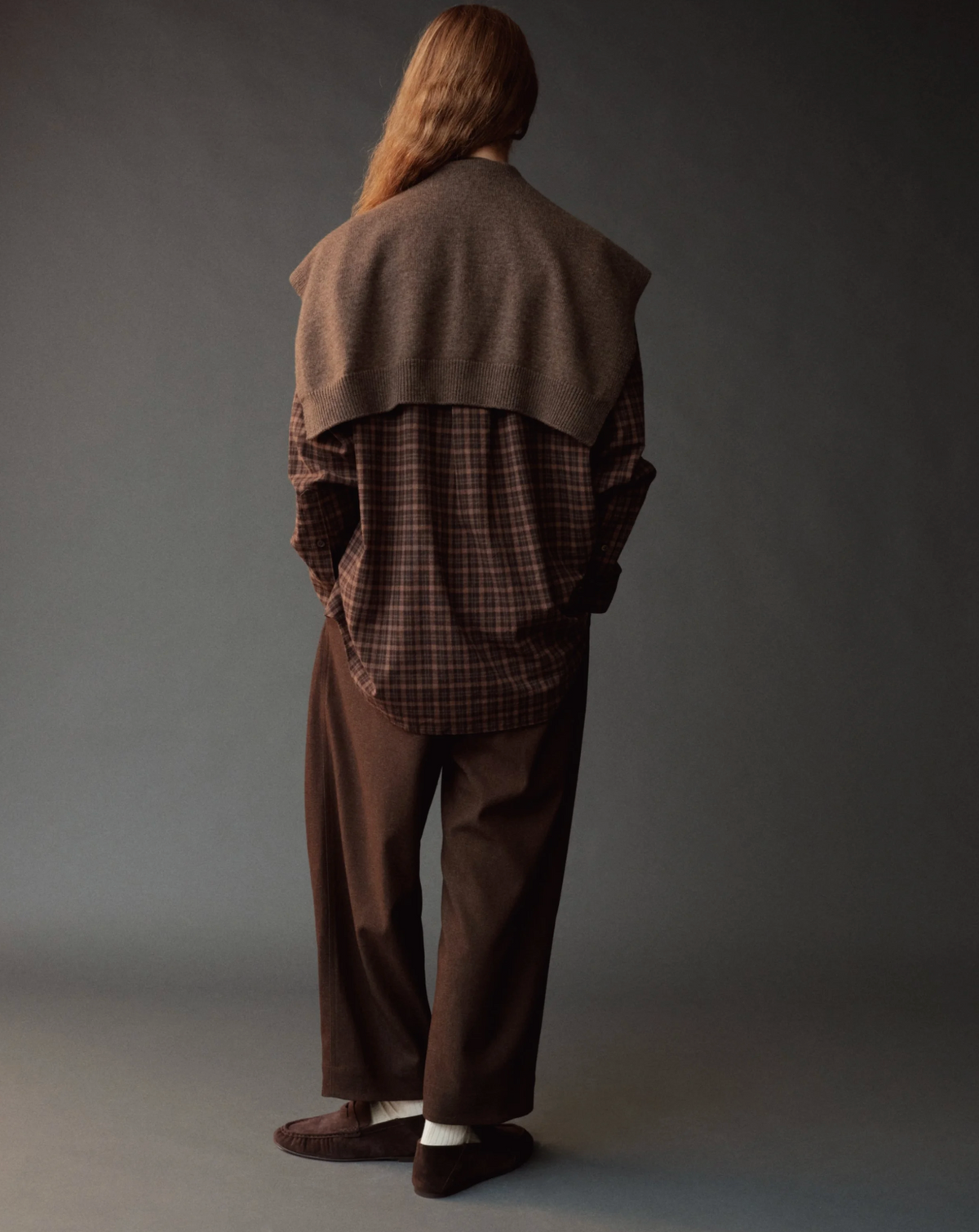 Brown shawl on model wearing a brown outfit