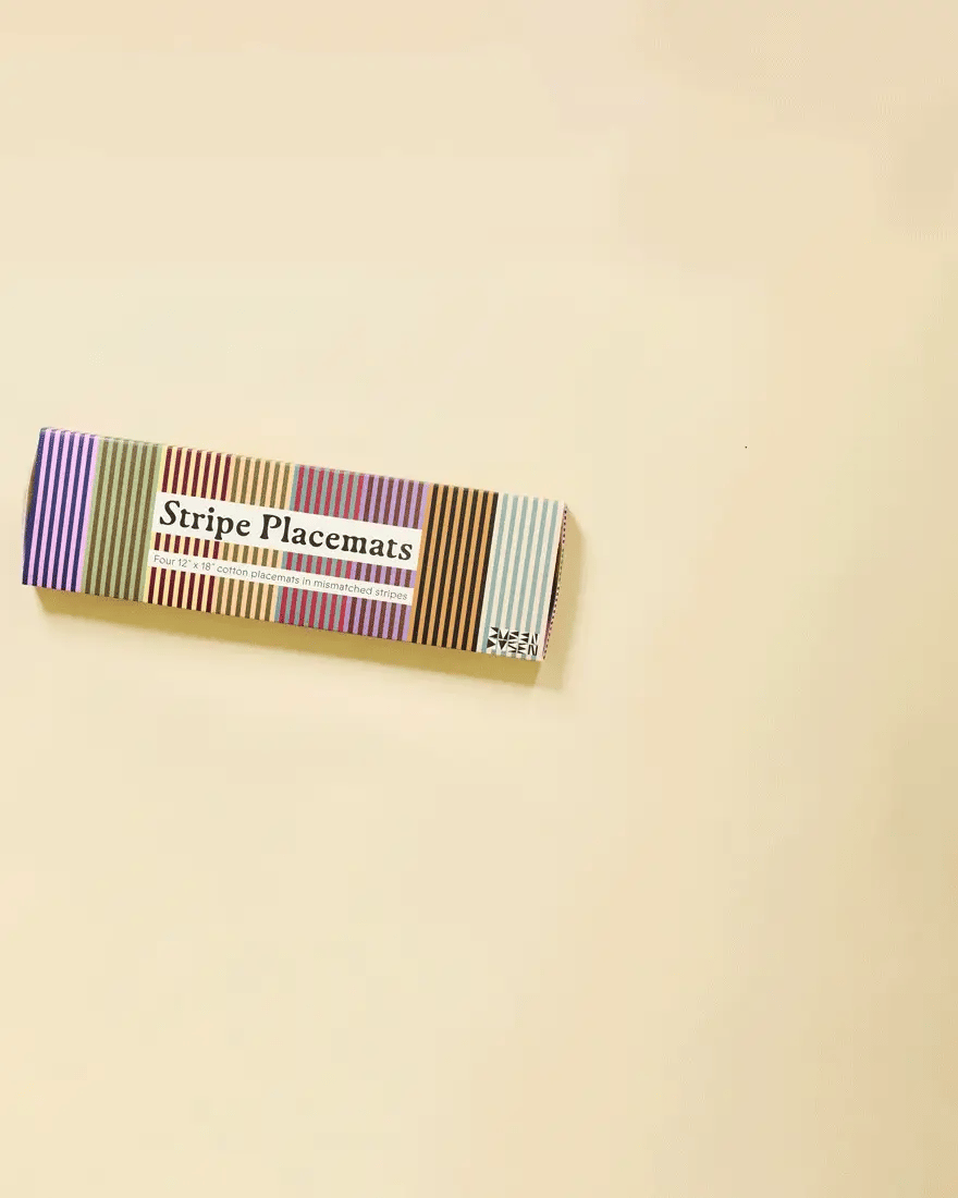 Box of stripe placemats on a beige background