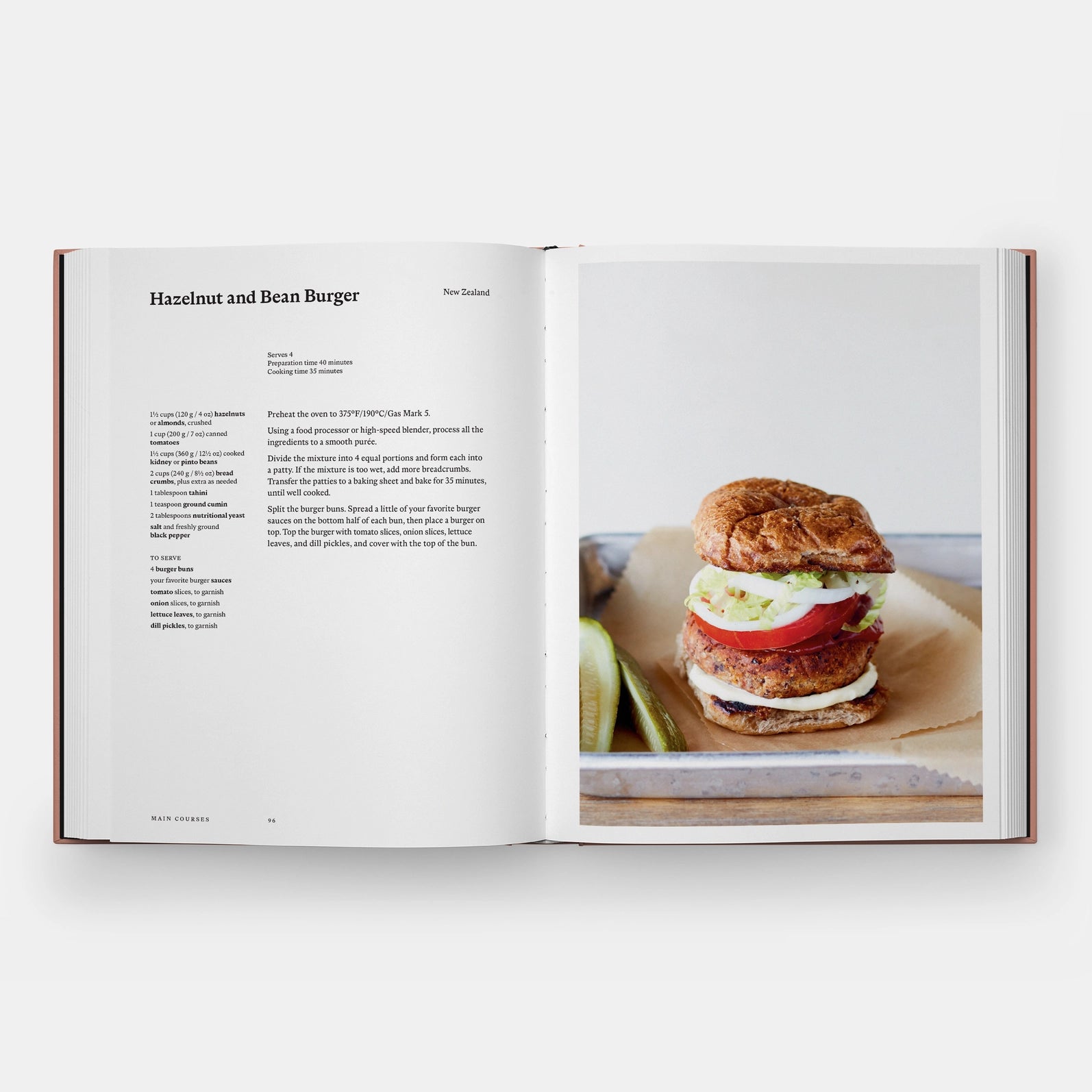Open book showing a recipe for a hazelnut and bean burger with an image of the burger on a white background.