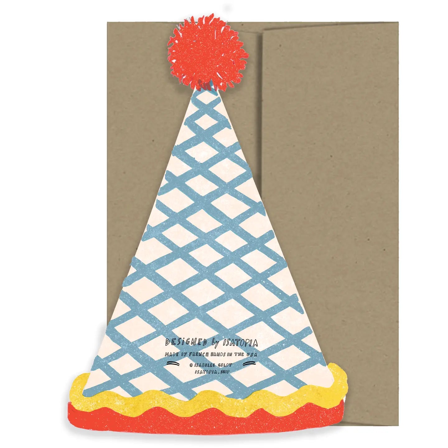 Colorful paper party hat with a red pom-pom on a brown envelope