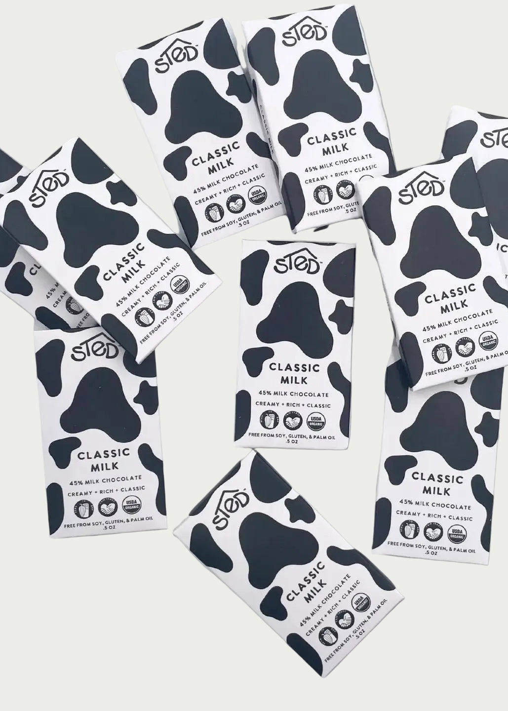 Multiple packages of  Classic Milk chocolate bars on a white background