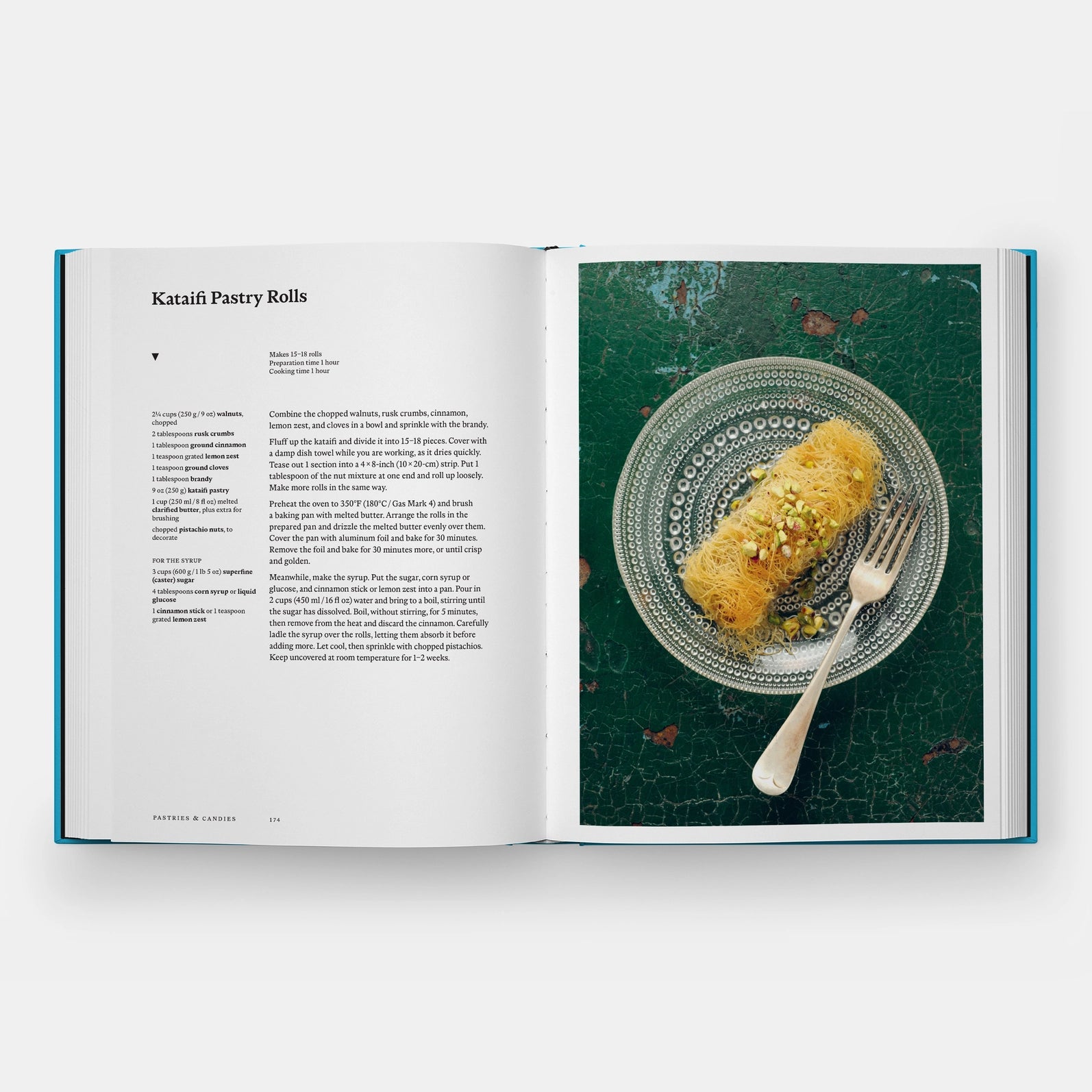 Open cookbook showing a recipe for Kataifi Pastry Rolls with an image of the dish on a green textured background.