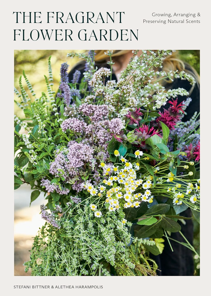 Book cover of 'The Fragrant Flower Garden' with a person holding flowers and text about growing, arranging, and preserving natural scents.