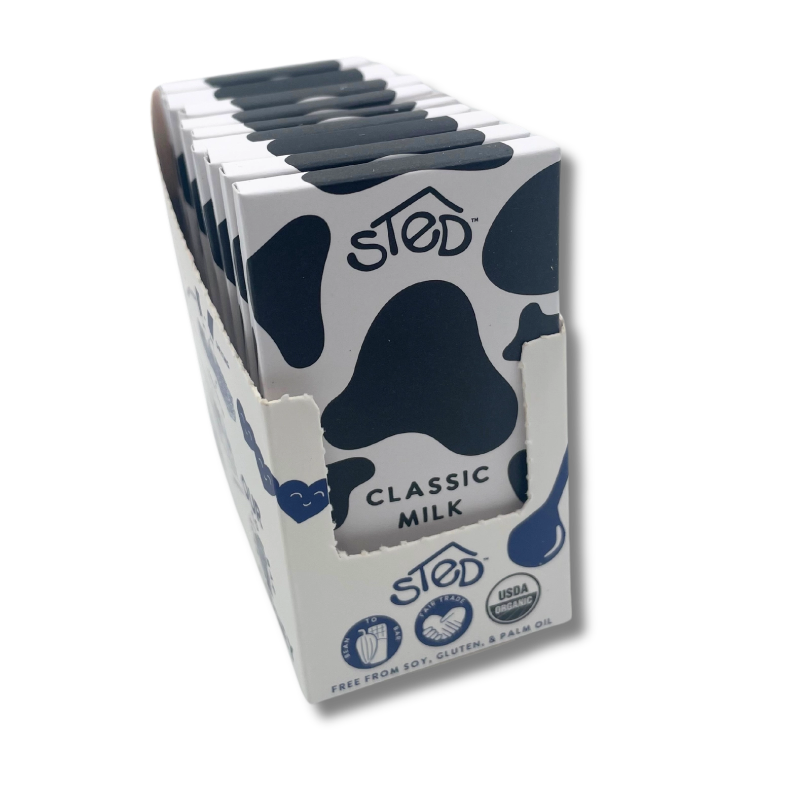 Carton of Sted Classic Milk with cow pattern on a white background