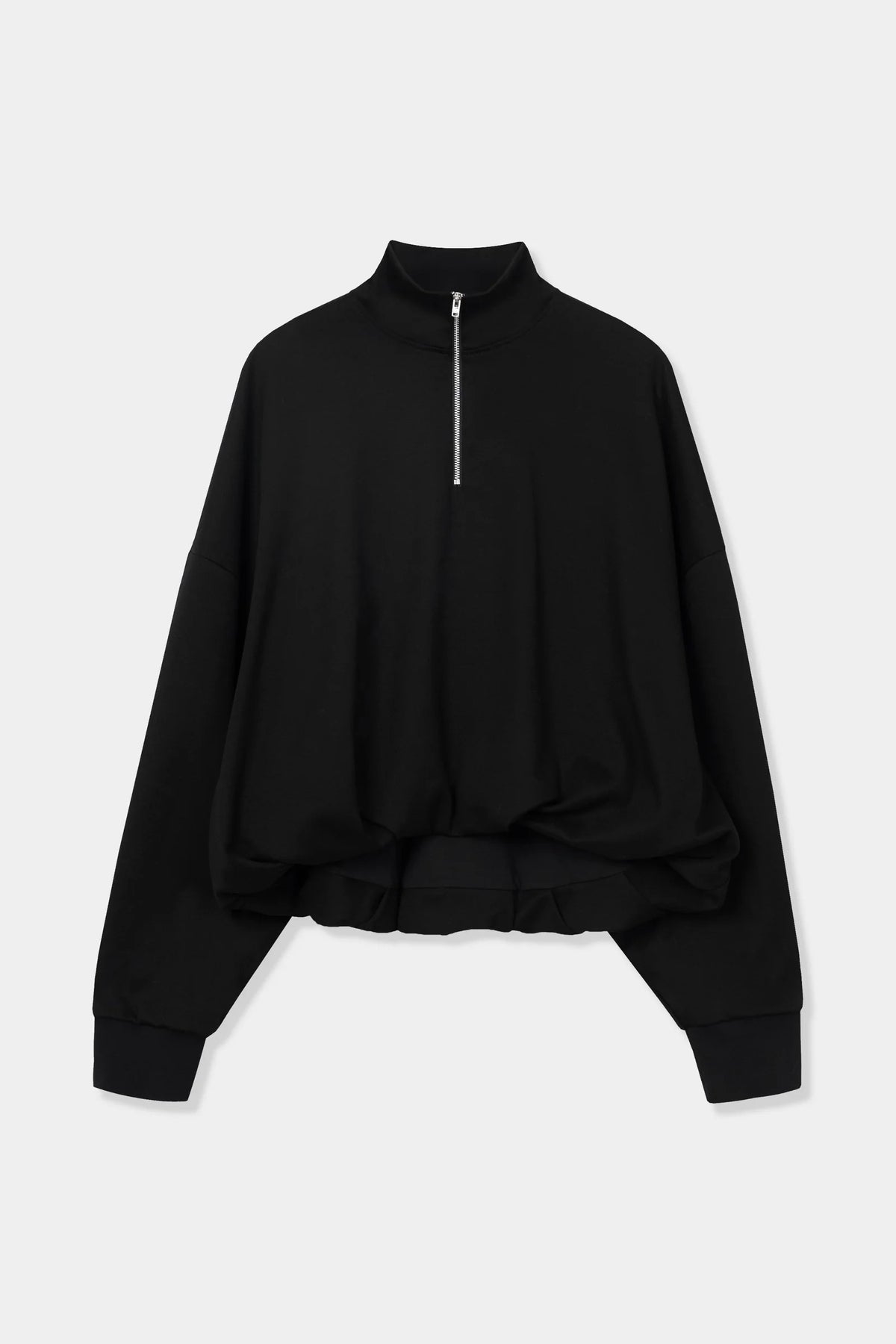 A black long-sleeve quarter-zip sweatshirt with a high mock neck and gathered, oversized fit, displayed on a light gray background.