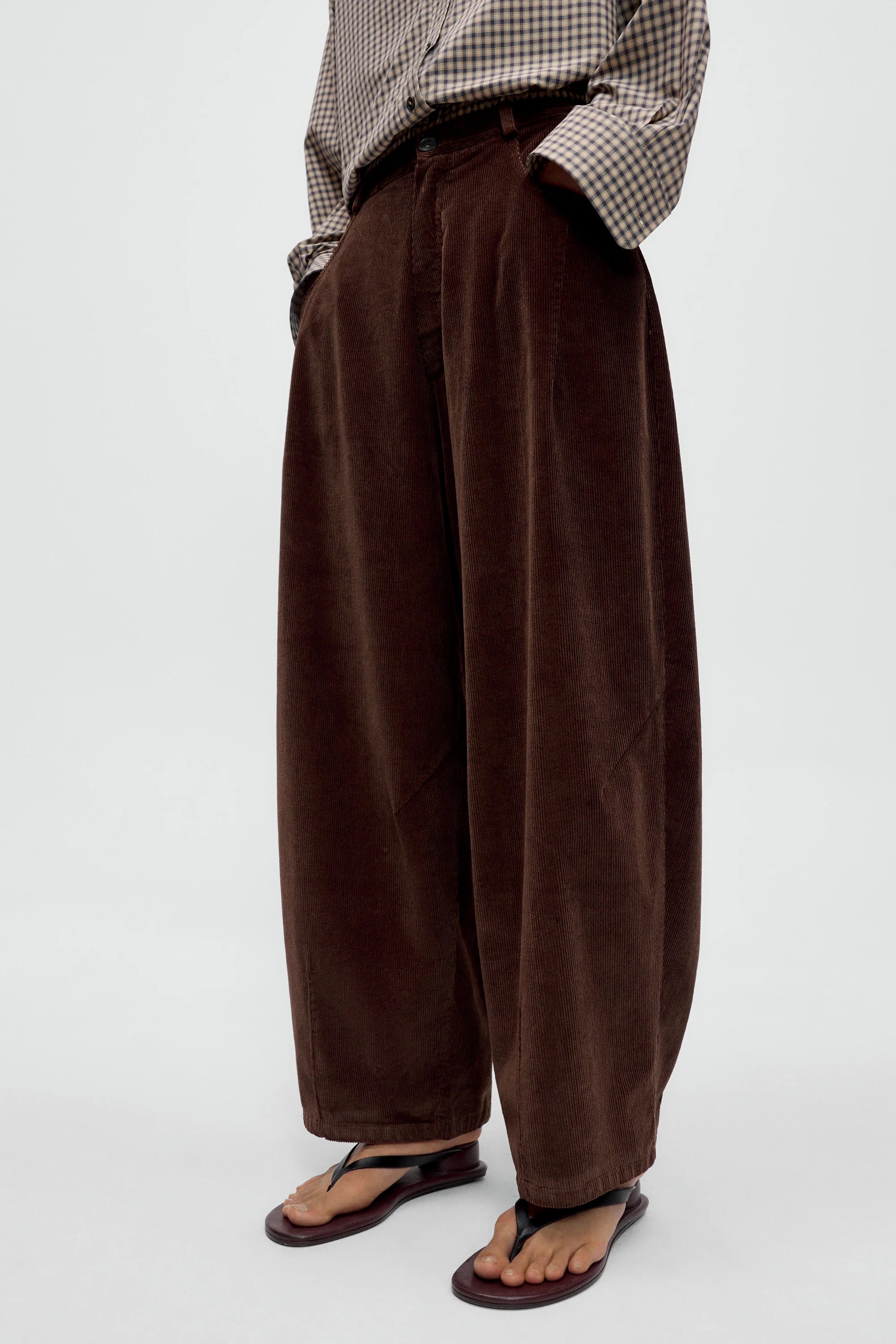 model wearing oversized brown cords