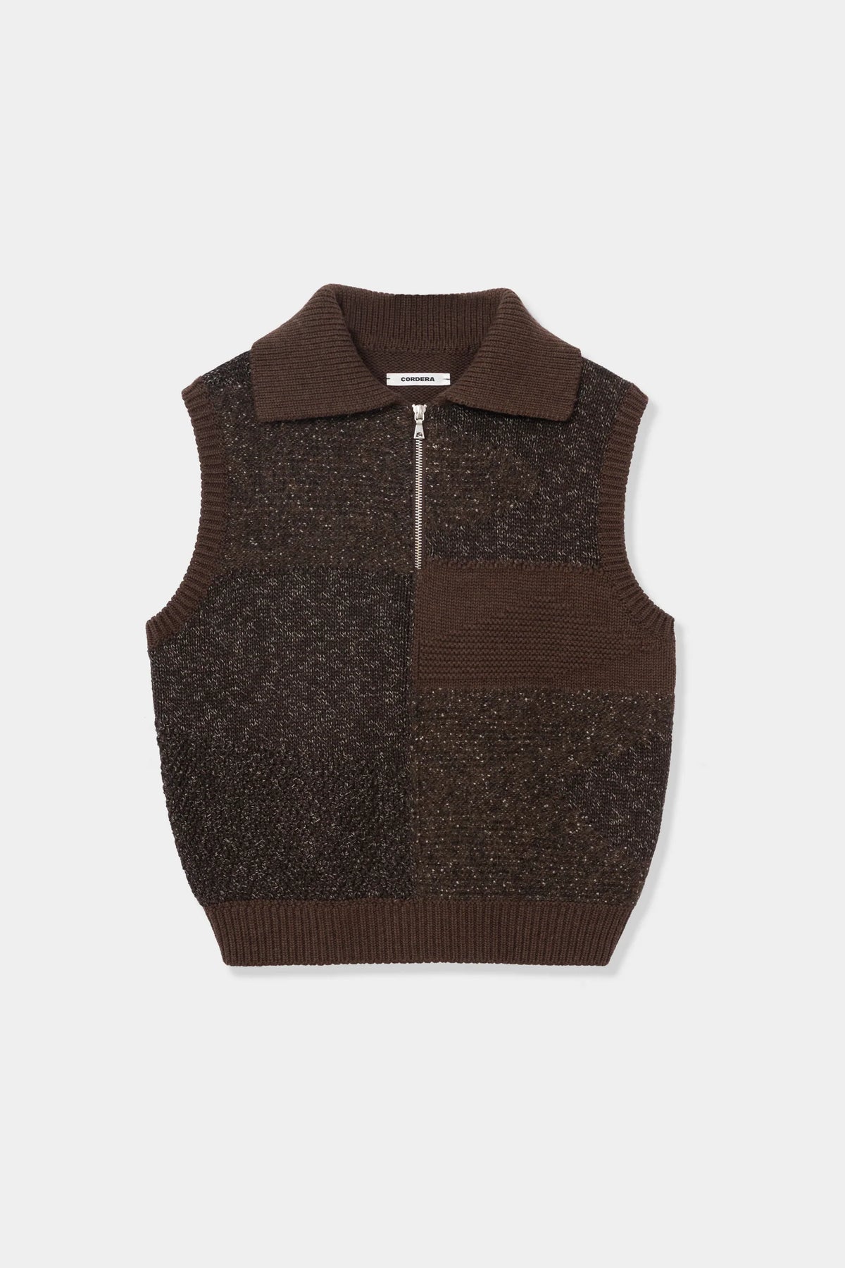 A dark brown knit zip-up vest with a polo collar and a horizontal ribbed chest pocket, shown flat on a light gray background.