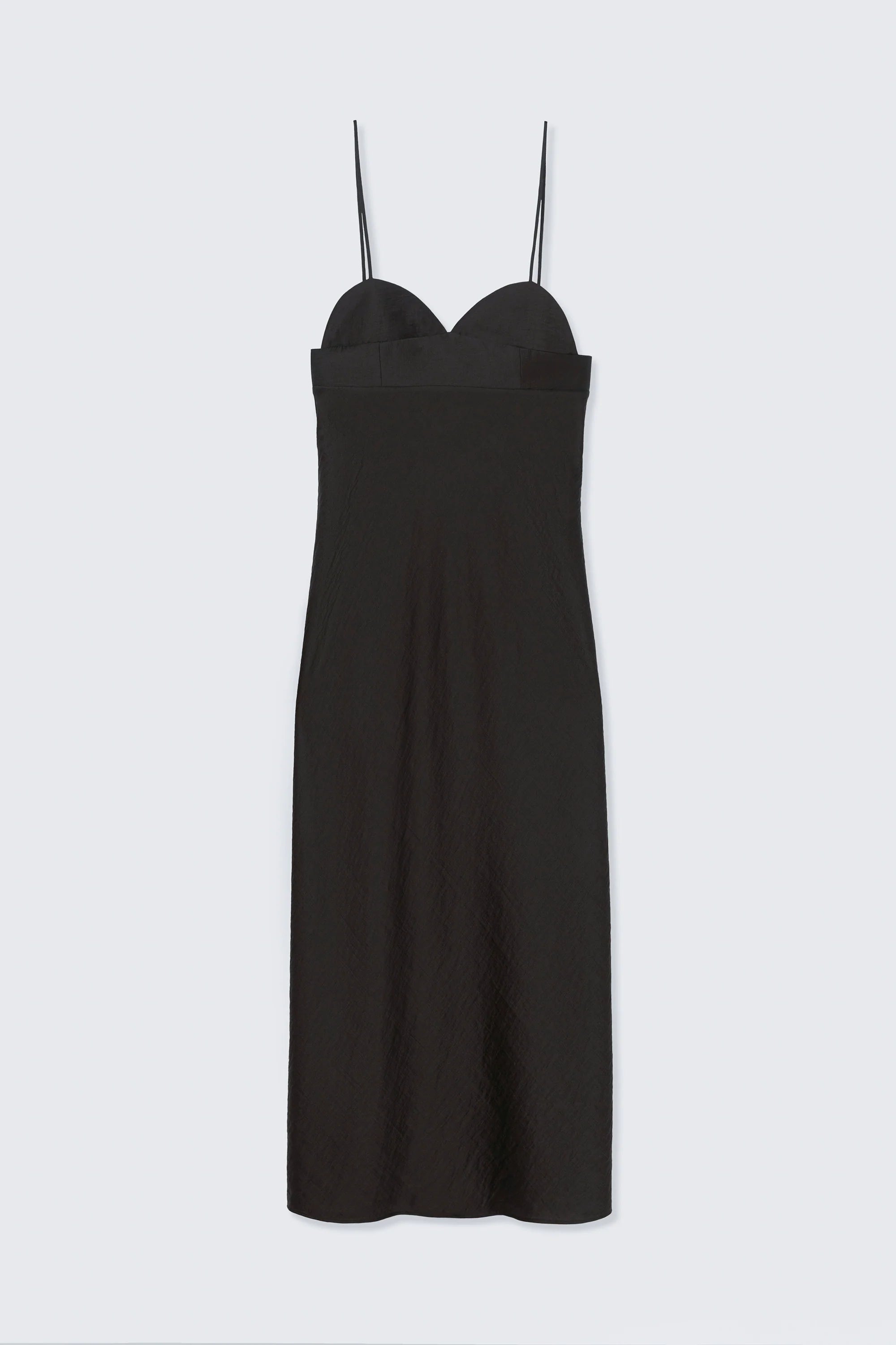 Black slip dress on a light gray background