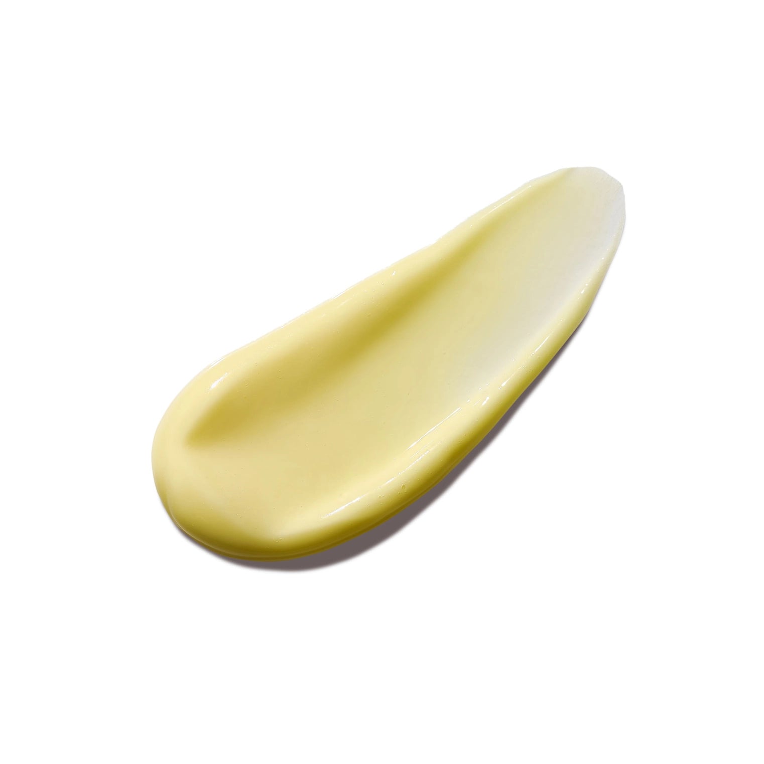 butter colored lotion on white background