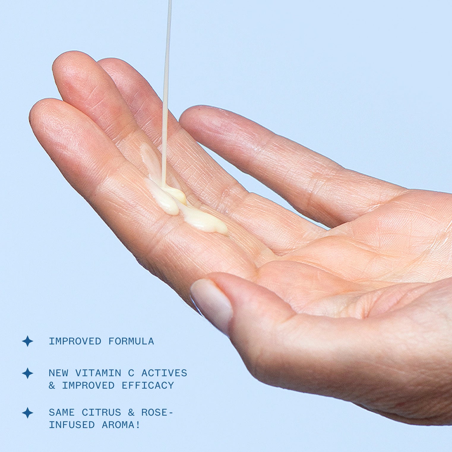 Hand holding a small amount of cream with product features listed below.