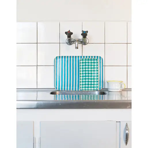 Kitchen sink area with a checkered tray